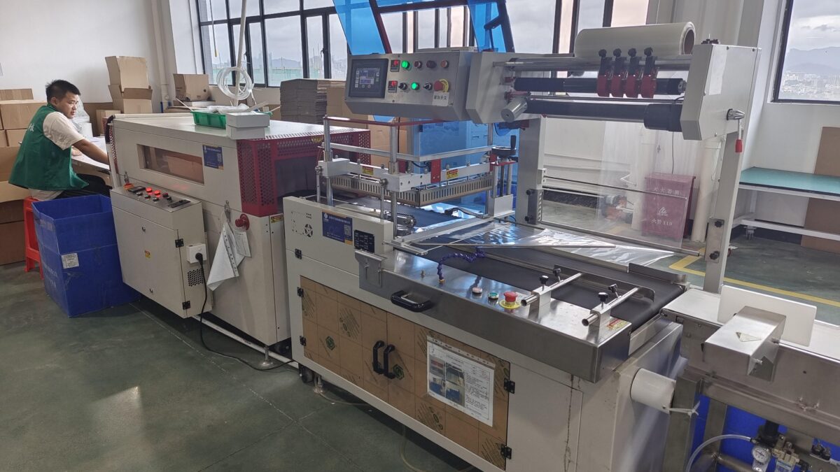 Hair dryer packaging production equipment inside a manufacturing facility