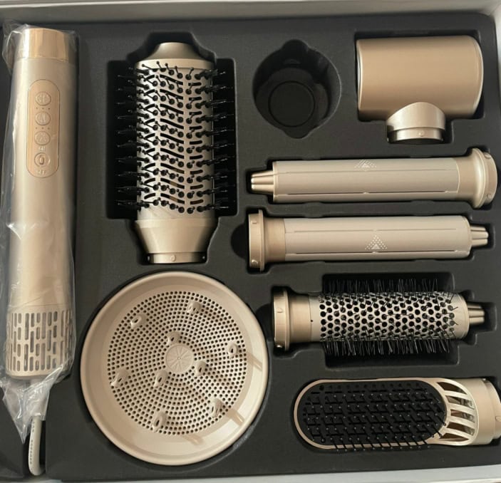 Hair styling tool with brush, diffuser, and comb accessories