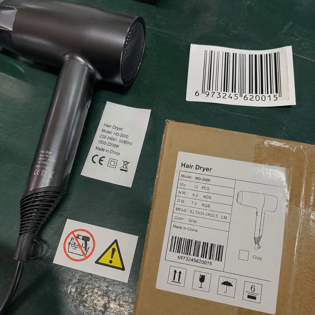 Travel hair dryer with barcode, warning labels, and packaging