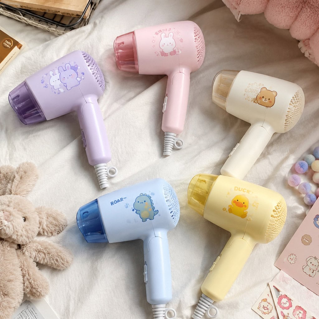 Pastel kids hair dryers arranged with character designs