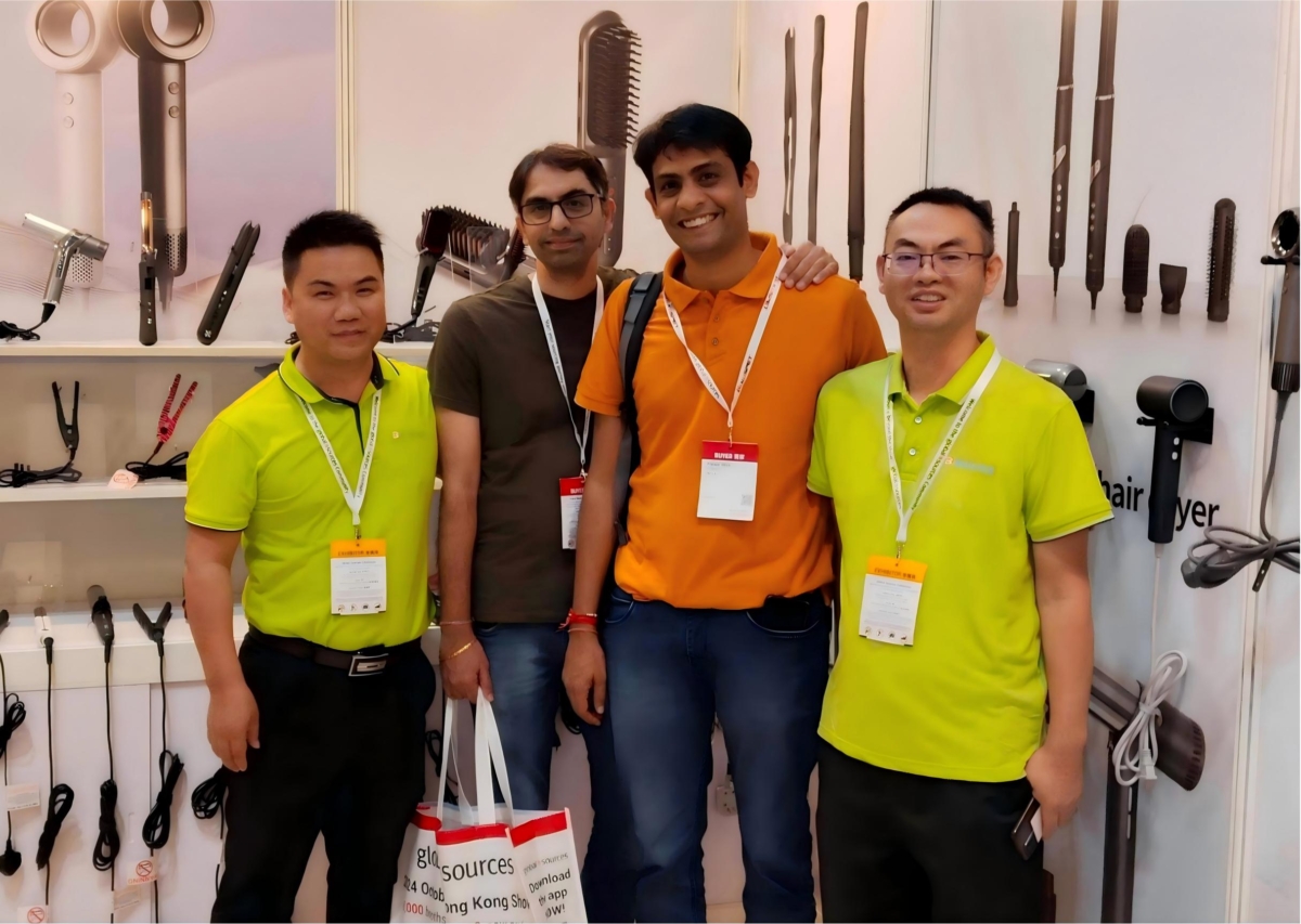 BAILE team members at a hair dryer trade show booth